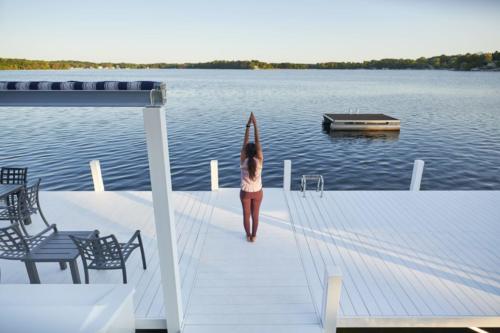 Woman performing yoga on a Classic pier